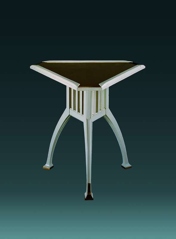 Triangular table with inlaid brass plate